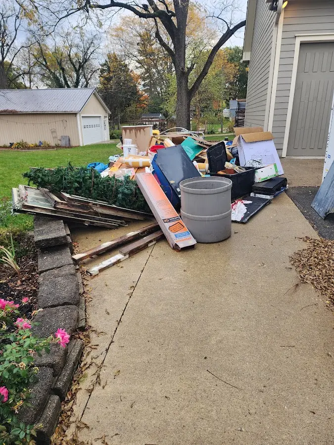 Dumpster being loaded with debris for 10 Yard Dumpster Rental in Frankford